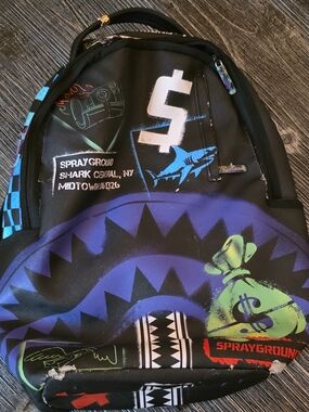Sprayground Black Backpack with Blue, Purple & Green Graphic Shark Design